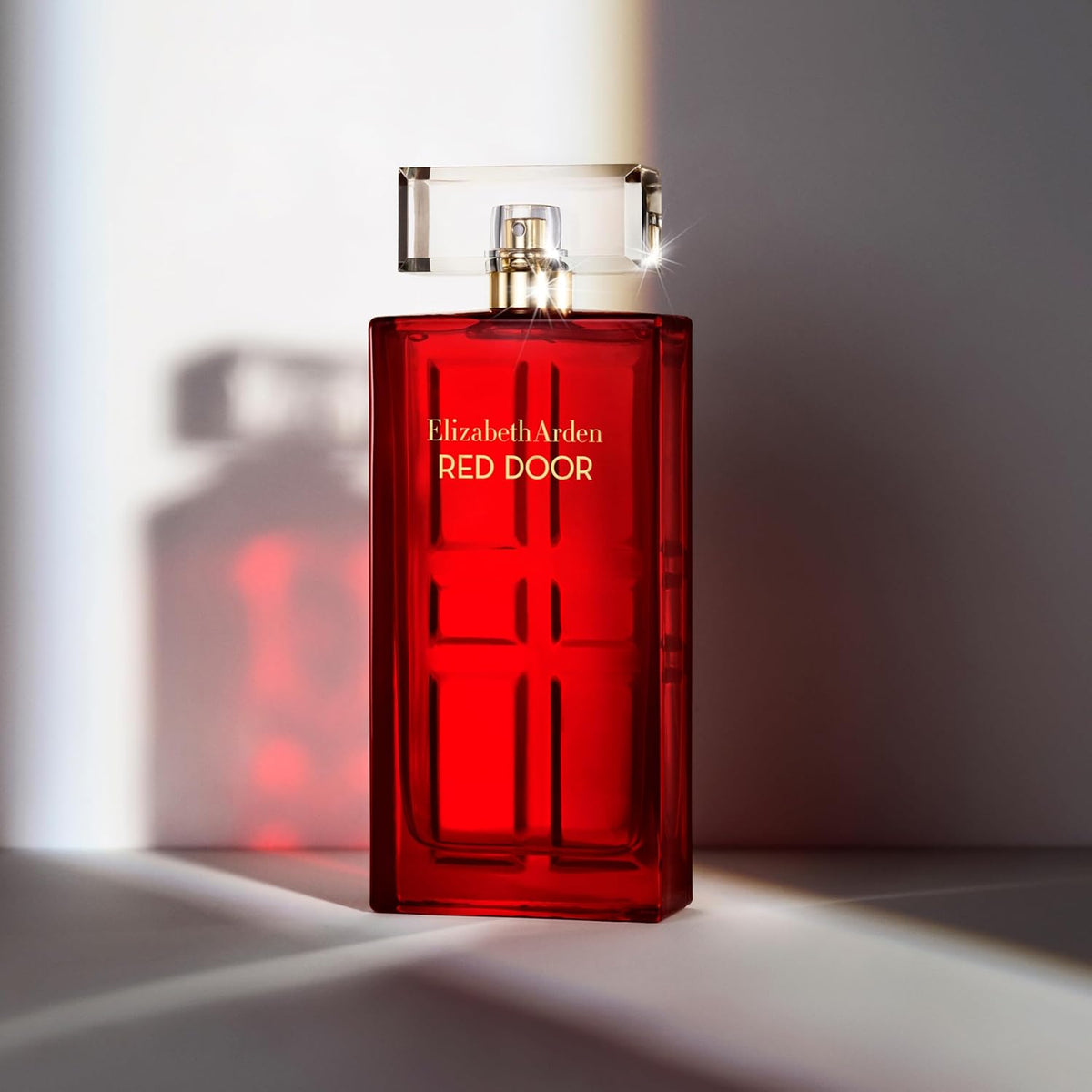 Elizabeth Arden Red Door Eau De Parfum for women, 1.7 fl oz, featuring a elegant perfume bottle with a gold cap and red accents.