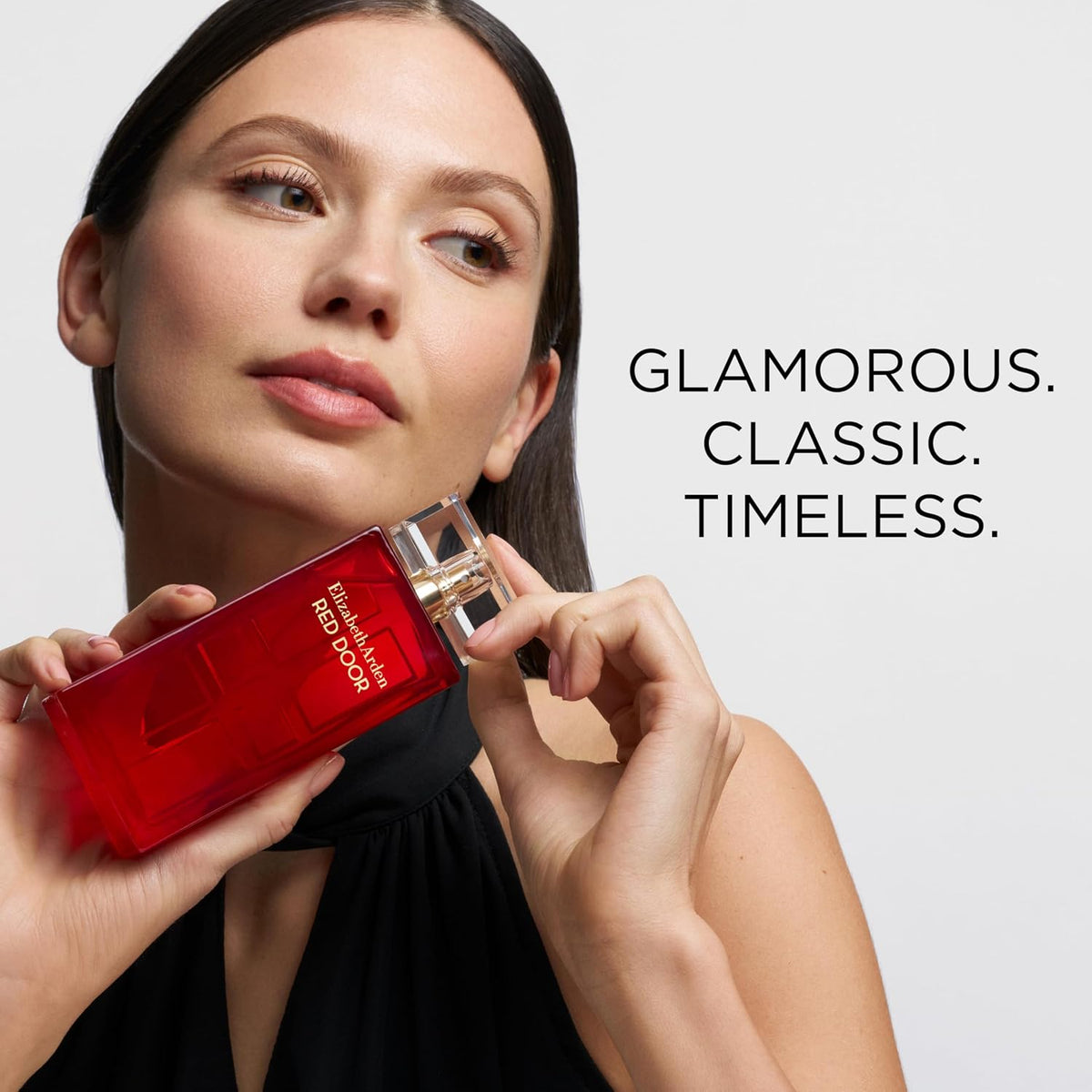 Elizabeth Arden Red Door Eau De Parfum bottle with elegant gold accents, 1.7 fl oz, showcasing a luxurious women’s perfume.