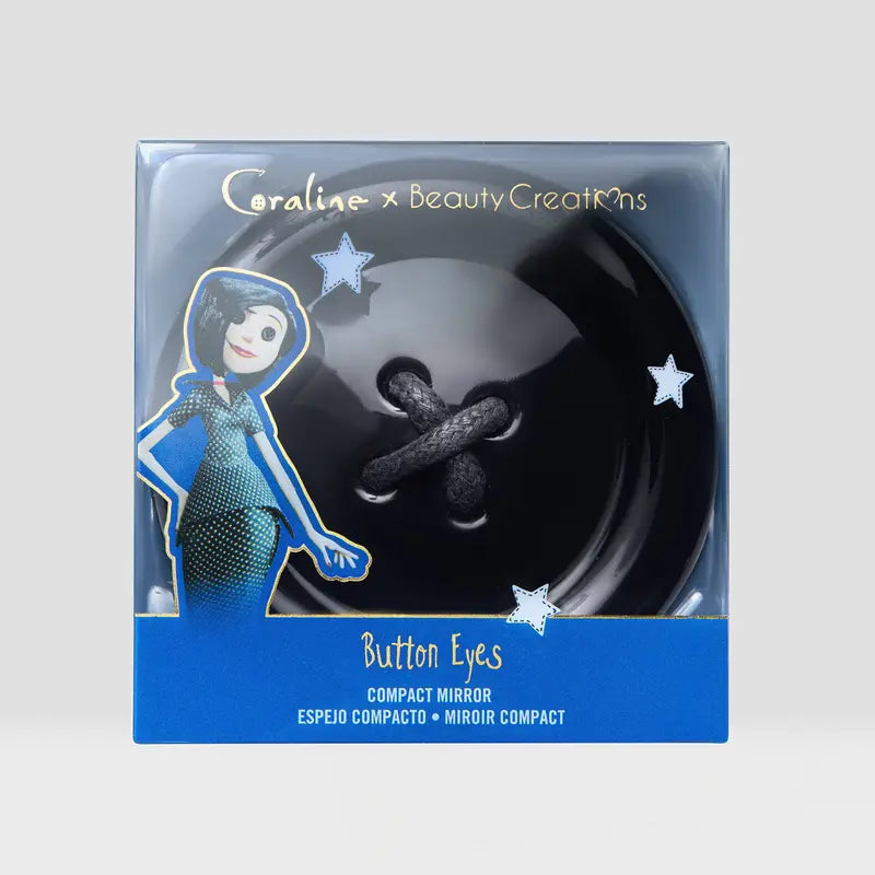 Beauty Creations Coraline Button Eyes Compact Mirror in stylish packaging featuring character design and button motif.
